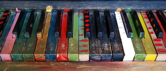 Multi-colored piano keys in need of cleaning